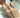 A close up of a hand with three diamond rings