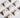 A spread of diamond stud earrings on a white layout