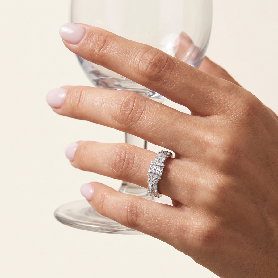 Arc Baguette Diamond Band Ring Holding a glass