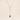 Gold necklace with a blue briolette teardrop pendant on a beige background