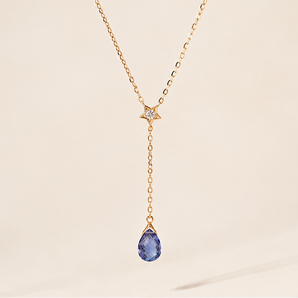 Gold necklace with a blue briolette teardrop pendant