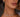 A lady with diamond necklaces and diamond earrings