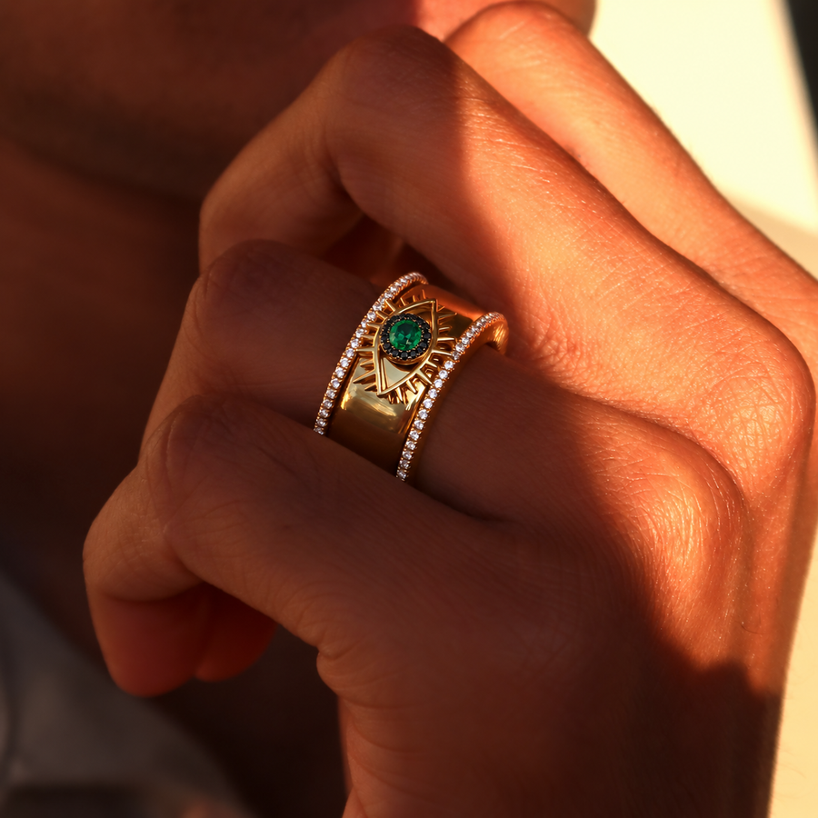 Gold Tichi Oura Ring Cap with an emerald evil eye and black spinel halo