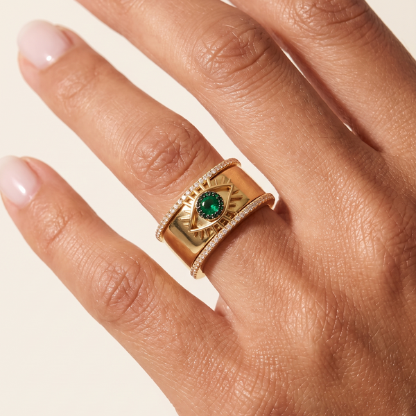 Gold Tichi Oura Ring Cap with an emerald evil eye and black spinel halo