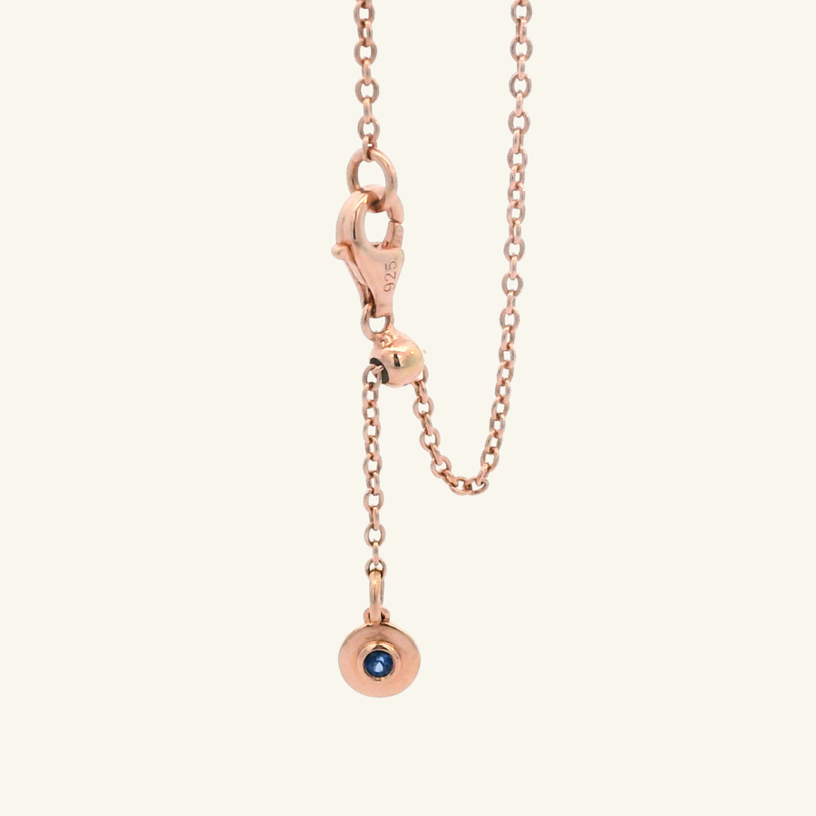 Closure with adjustable sizing to any wrist. The pendant has a blue sapphire detail.